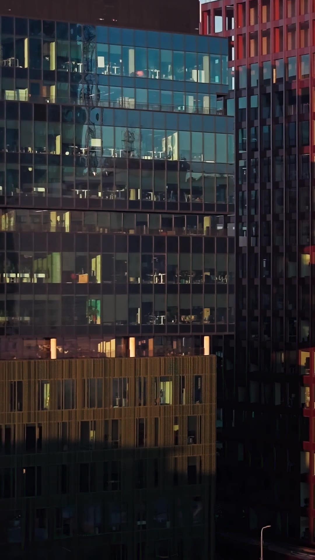 Glass towers glowing at dusk over the city